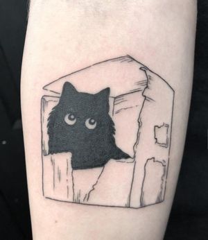 Elegant blackwork tattoo by Amandine Canata featuring a cat peeking out of a box, perfect for pet lovers.