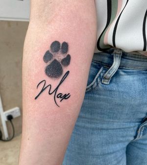 Unique blackwork and dotwork tattoo featuring intricate lettering of your pet's paw print by Alfonso Barberio.