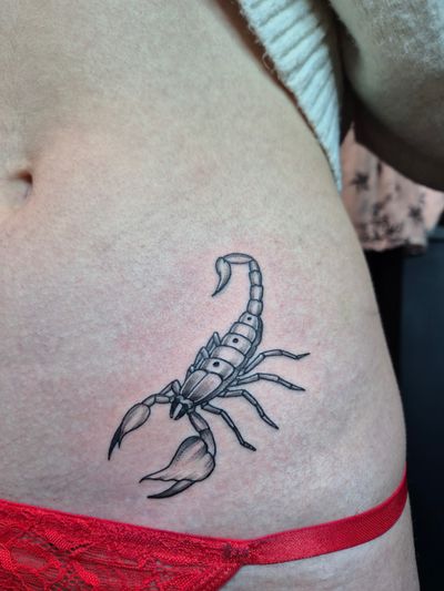 A black and gray tattoo of a majestic scorpion created with intricate dotwork by Maibri Tattooing.