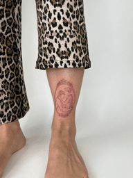Embracing Figures Tattoo
