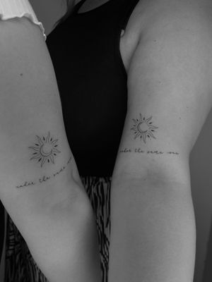 Get a beautifully intricate sun and moon tattoo by Ruth Hall, featuring delicate small lettering.