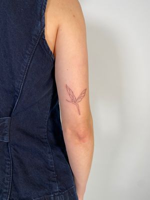 Delicate fine line tattoo of a fairy, created with minimalistic style by artist Chloe Hartland.