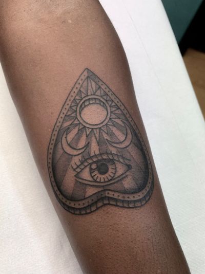 Beautifully crafted sun, moon, ouija, and eye motifs by Marc 'Cappi' Caplen for a mystical and captivating tattoo.