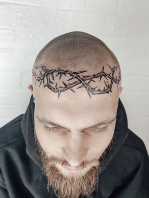Illustrative design by Alexandra Mulhall featuring a crown and crown of thorns motif, perfect for a bold and unique tattoo.