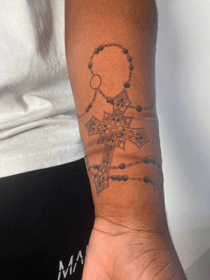 Illustrative Cross and Rosary Beads over Scar Tissue