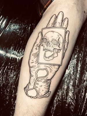 Fine line illustrative tattoo of a skull in a medieval engraving style by Alexandra Mulhall.