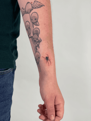 Illustrative blackwork tattoo of a sleek black widow spider by Chloe Hartland.