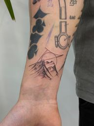 Geometric Mountain and Sun Tattoo