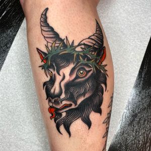 Celebrate Megan Foster's skillful blend of symbolism with this stunning traditional tattoo of a goat, head, thorns, and lamb design.