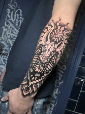 Embrace the mystique of Ancient Egypt with this blackwork, dotwork, illustrative Anubis tattoo by talented artist Hamid.