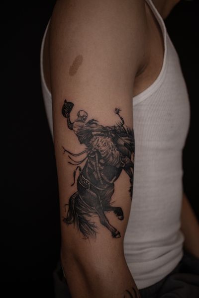 Finelined, black and grey skull cowboy riding horse, on arm