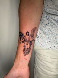 Winged Figure Tattoo
