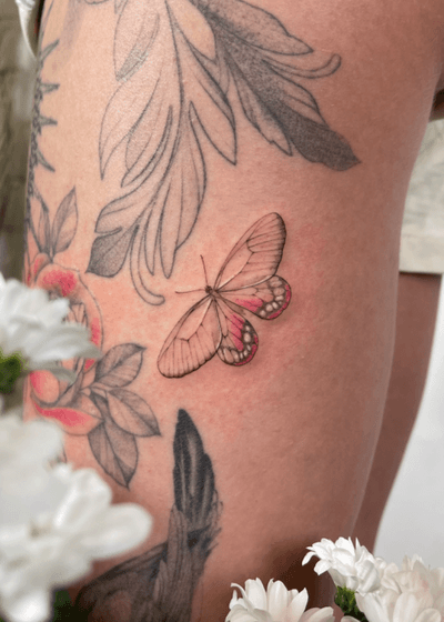 Butterfly in fine line tattoo style with pink shading. It was done in its natural size