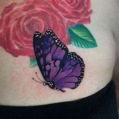 Realistic purple butterfly cover-up