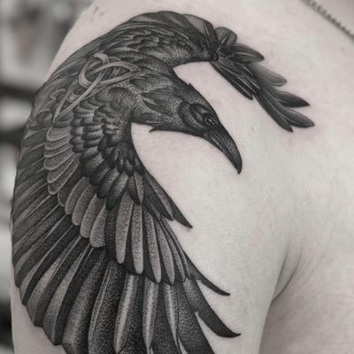 Express your dark side with this haunting black and gray illustrative crow tattoo by Dani Mawby.