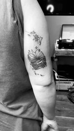 Stack of Books with Flowers and Floating Elements