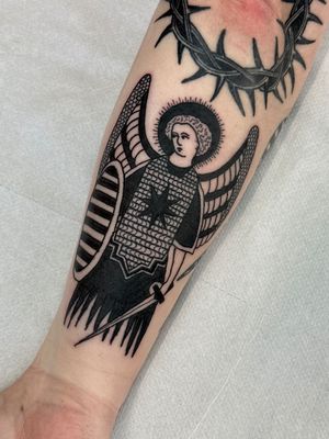 Capture the medieval essence with this blackwork, illustrative tattoo of the powerful Archangel Michael.