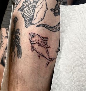 Get a unique and detailed fish tattoo designed by the talented artist Miss Vampira. Perfect for lovers of aquatic themes!