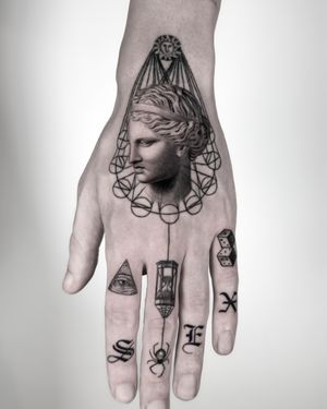 Explore the beauty of fine line and geometric design with this micro realism tattoo by Jay Soze inspired by Greek mythology statues.