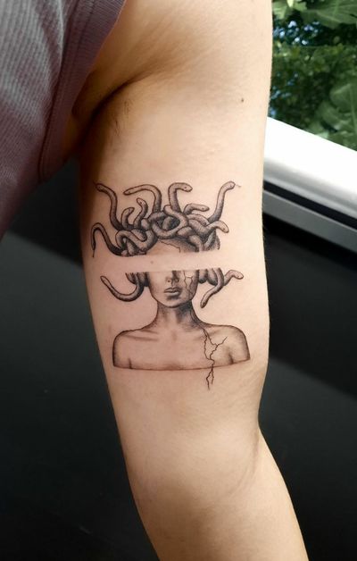 Experience the mesmerizing beauty of micro-realism with this black and gray dotwork tattoo of Medusa and a snake by Liberty C. Stunning details bring this mythical design to life.