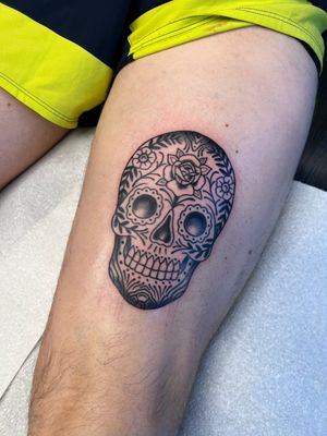 Unique blackwork tattoo featuring a detailed sugarskull design, expertly done by talented artist Kayleigh Cole.