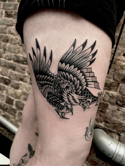 Get a timeless traditional eagle tattoo in black and gray or blackwork style by the talented artist Barney Coles.