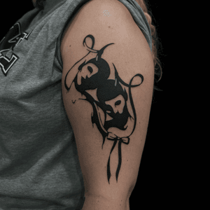 A bold blackwork design by Connor Howerton featuring a devil, demon, ribbon, lace, and bow with contrasting 'smile now, cry later' motif.