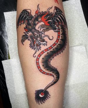 Embrace the power of the mythical with this illustrative dragon tattoo by the talented artist Megan Foster.