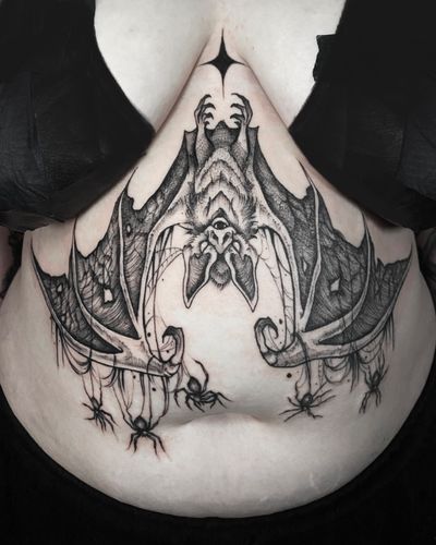 Gothic bat sternum tattoo 