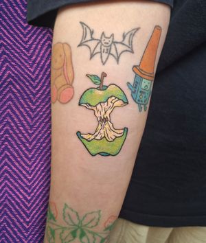 Experience a unique hand-poke style tattoo of a vibrant green apple by the talented Rachel Howell. Illustrative and colorful!