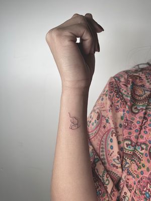 Fine line, ignorant style tattoo of a minimal elephant design by the talented artist Alina Amberland.