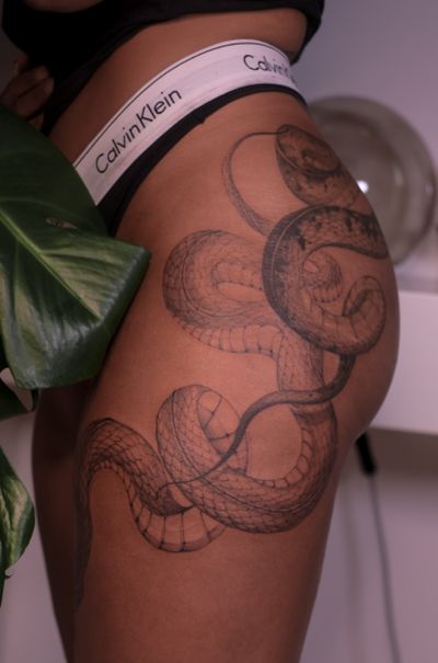 Stunning black and gray fine line snake tattoo by Maria, with intricate details and a mesmerizing design.