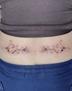 Symmetrical Floral Swirl Tattoos