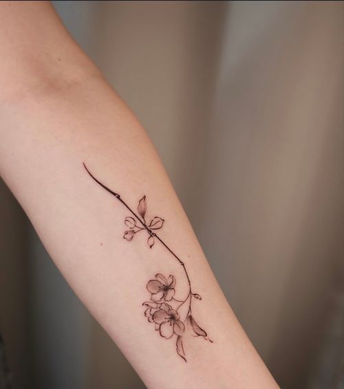 Delicate Cherry Blossom Arm Tattoo