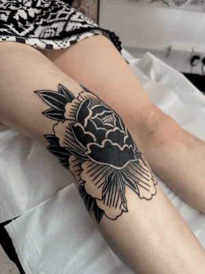 Detailed blackwork Japanese-style peony tattoo by artist Jakob Isaac.