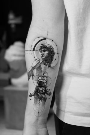 Light Grays blend fine lines and micro-realism to create a stunning black and gray tattoo of a mythological astronaut. Embrace the cosmos and ancient Greek mythology in one unique design.