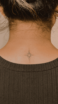Tiny fine line star on the neck