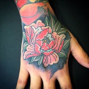 Tattoo uploaded by Graceland Tattoo • Flower power by Joe Pepper (IG:  joe_pepper) #gracelandtattoo #traditional #japanese #hand #peony #flower •  Tattoodo