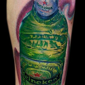 Awesome rendition of the #Heineken #bottle. It looks so #cold &amp; #fresh. Tattoo by #CecilPorter.