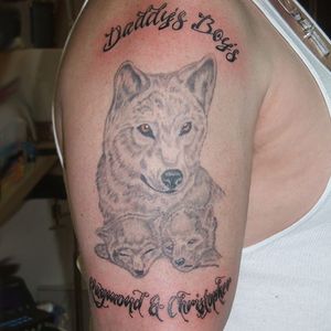 Wolf and script done here at Kelly's Tattoo House #wolf #script #kellystattoohouse 
