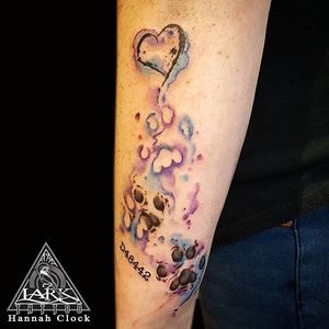 Watercolor style tattoo of paw prints and heart by Lark Tattoo artist Hannah Clock #watercolor #watercolortattoo #watercolour #pawprint #heart 