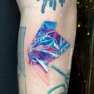 Cellophane tattoo by Shannon Perry #ShannonPerry #besttattoos #color #realism #realistic #hyperrealism #surreal #strange #cellophane #sparkle #pretty #paper #tattoooftheday