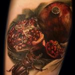 Color realism pomegranate and insect still life tattoo by Maija Arminen. #realism #colorrealism #stilllife #fruit #pomegranate #insect #bug #MaijaArminen