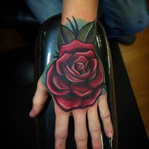 Bold and solid looking rose hand tattoo by Shane Klos. #shaneklos #neotraditional #illustrative #revolutioninkstudio #rose #handtattoo