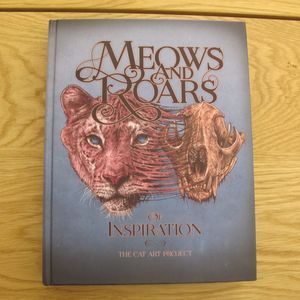 The cover of Meows and Roars of Inspiration. #artbook #cats #felines #fineart #MeowsandRoarsofInspiration #tattoobook