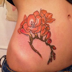 Orange freesia tattoo by yuuztattooer. #traditional #flower #freesia #botanical #yuuztattooer