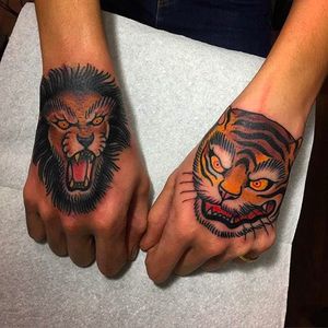 Lion and Tiger Hand Tattoos by Pliz @Pliz_lpn #Pliztattoo #Blackpearltattooparlour #Milano #Animaltattoo #Traditional #Oldschool #Neotraditional #Lion #Tiger