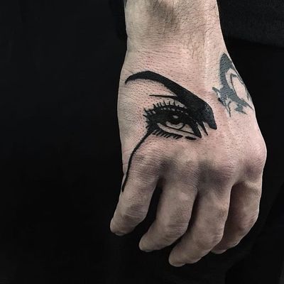 Crying eye tattoo by Stray Dog Society #StrayDogSociety #blackworktattoos #blackwork #eye #crying #sadgirl #graphic #popart #eyelashes #bold