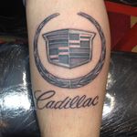 A black and grey Cadillac insignia by Louie Figueroa (IG—loufigueroatattoos). #Caddy #Cadillac #LouieFigueroa