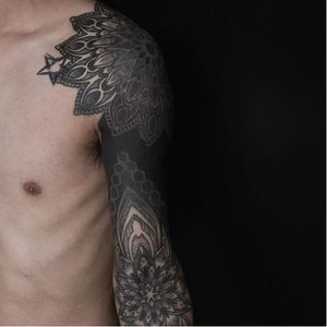 Blackwork sleeve tattoo by Kenji Alucky, photo from Kenji's Instagram @black_ink_power #geometric #blackwork #tribal #patternwork #dotwork #dotshading
